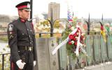 2012 Memorial Service - Officer standing at attention with wreath (2)