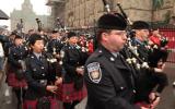 2012 Memorial Service - Officers with bagpipes marching in front of onlookers (2)